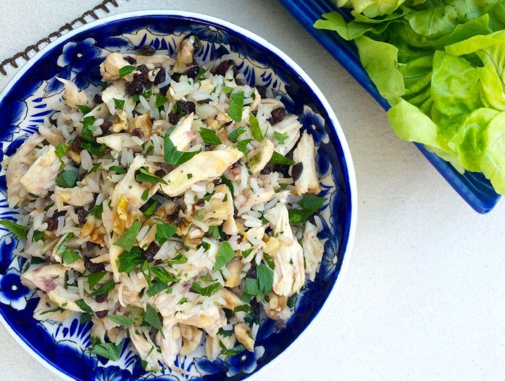 Chicken and rice in blue and white bowl overhead