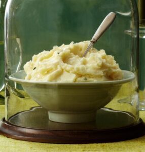 Close up of mashed potatoes under glass