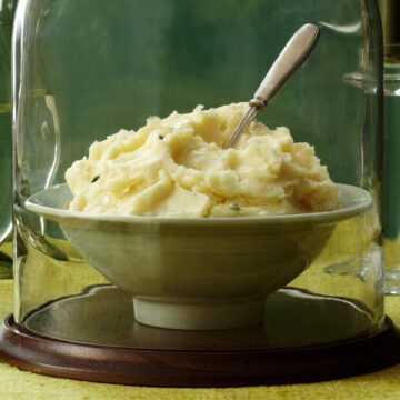 Close up of mashed potatoes under glass
