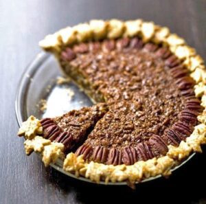 Gingered Coconut Pecan Pie with piece missing