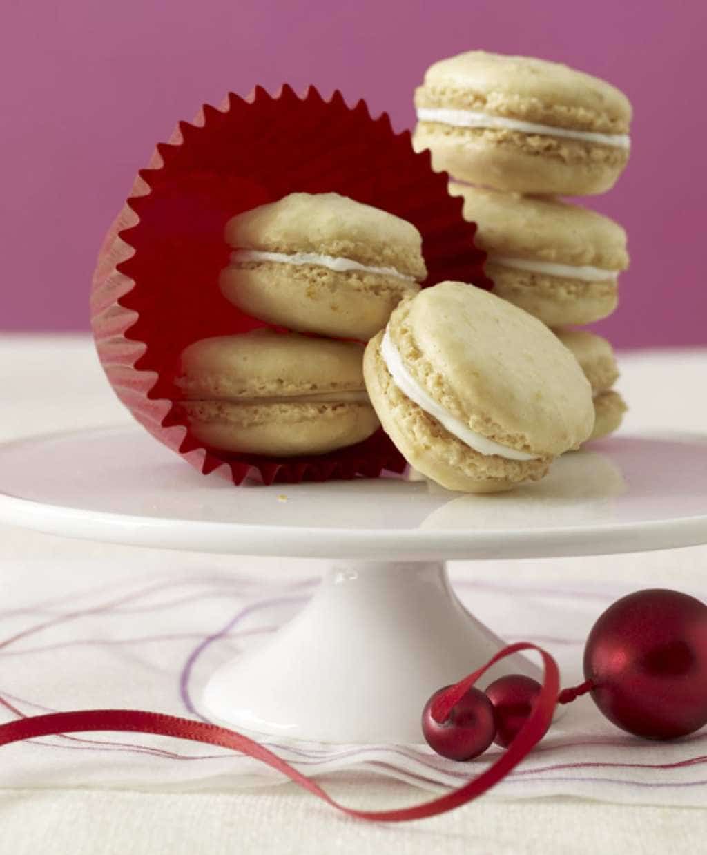 Clementine Almond Cookies on cake plate w red ornament