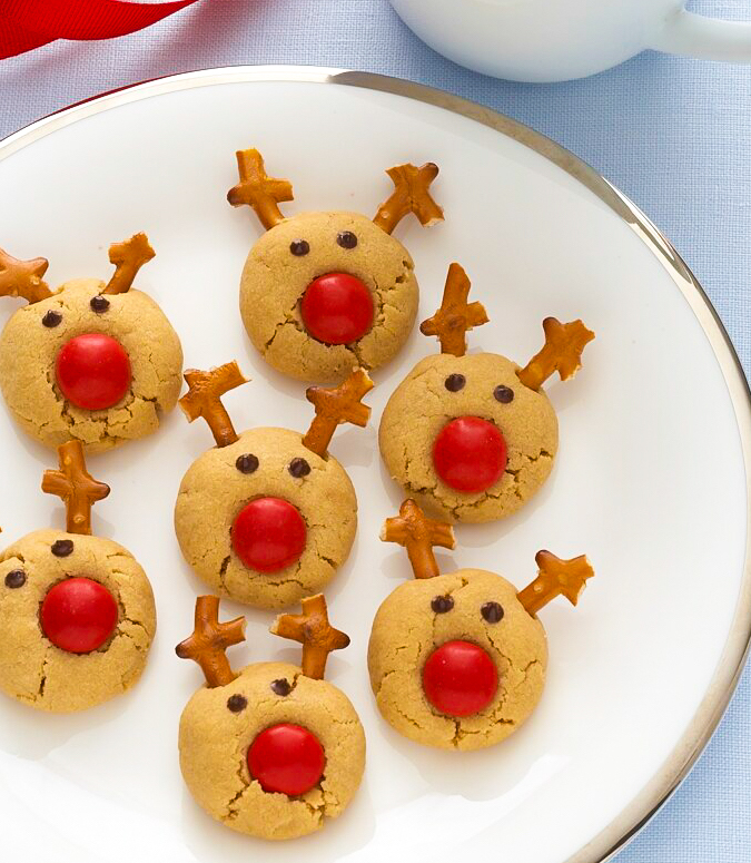 rudolph reindeer cookies on white plate