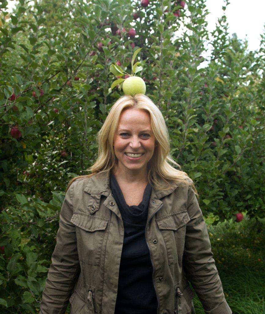 Tara with a green apple on her head