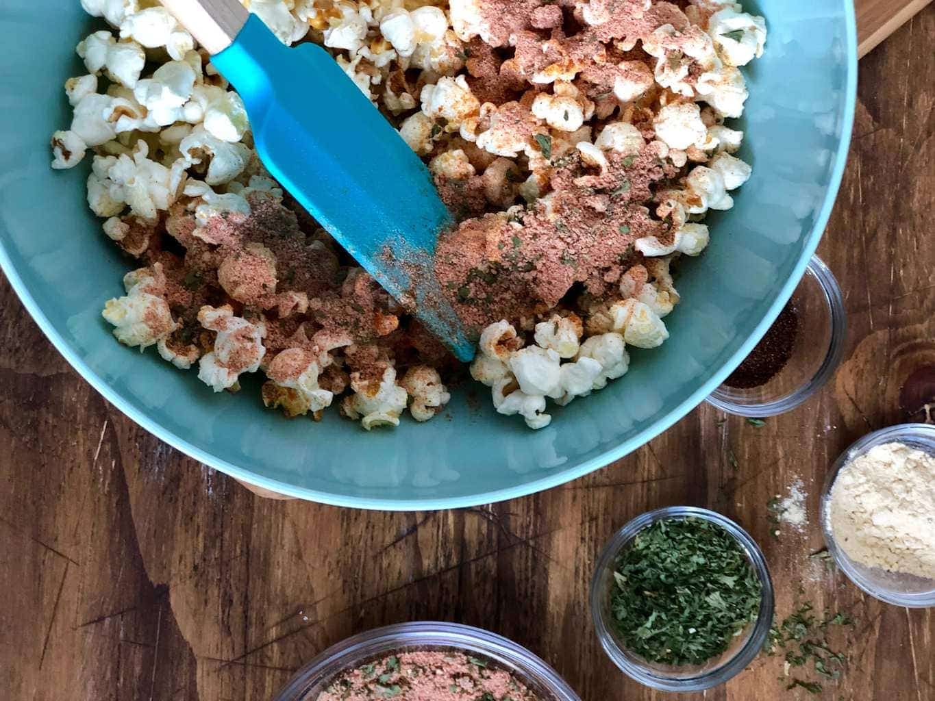 Popcorn and seasonings in blue bowl