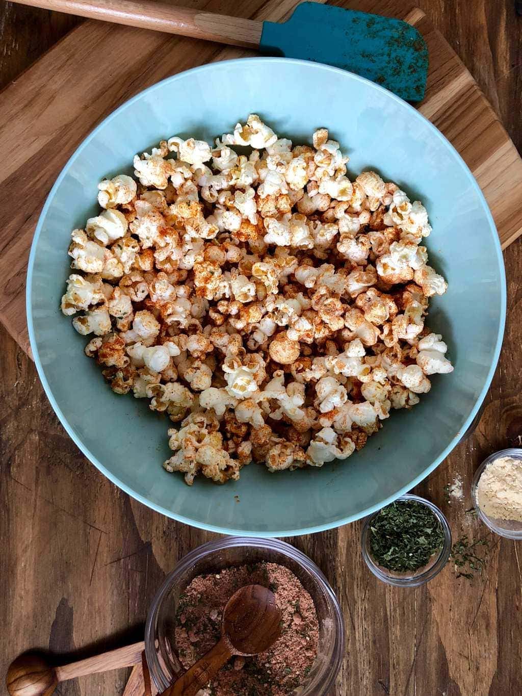 BBQ Popcorn in a blue bowl ready for snacking