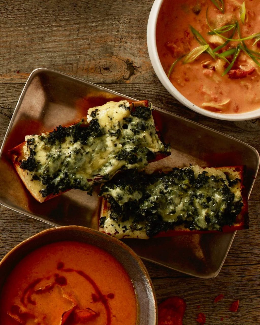 open faced spinach melts with cheese and spinach melted on french bread