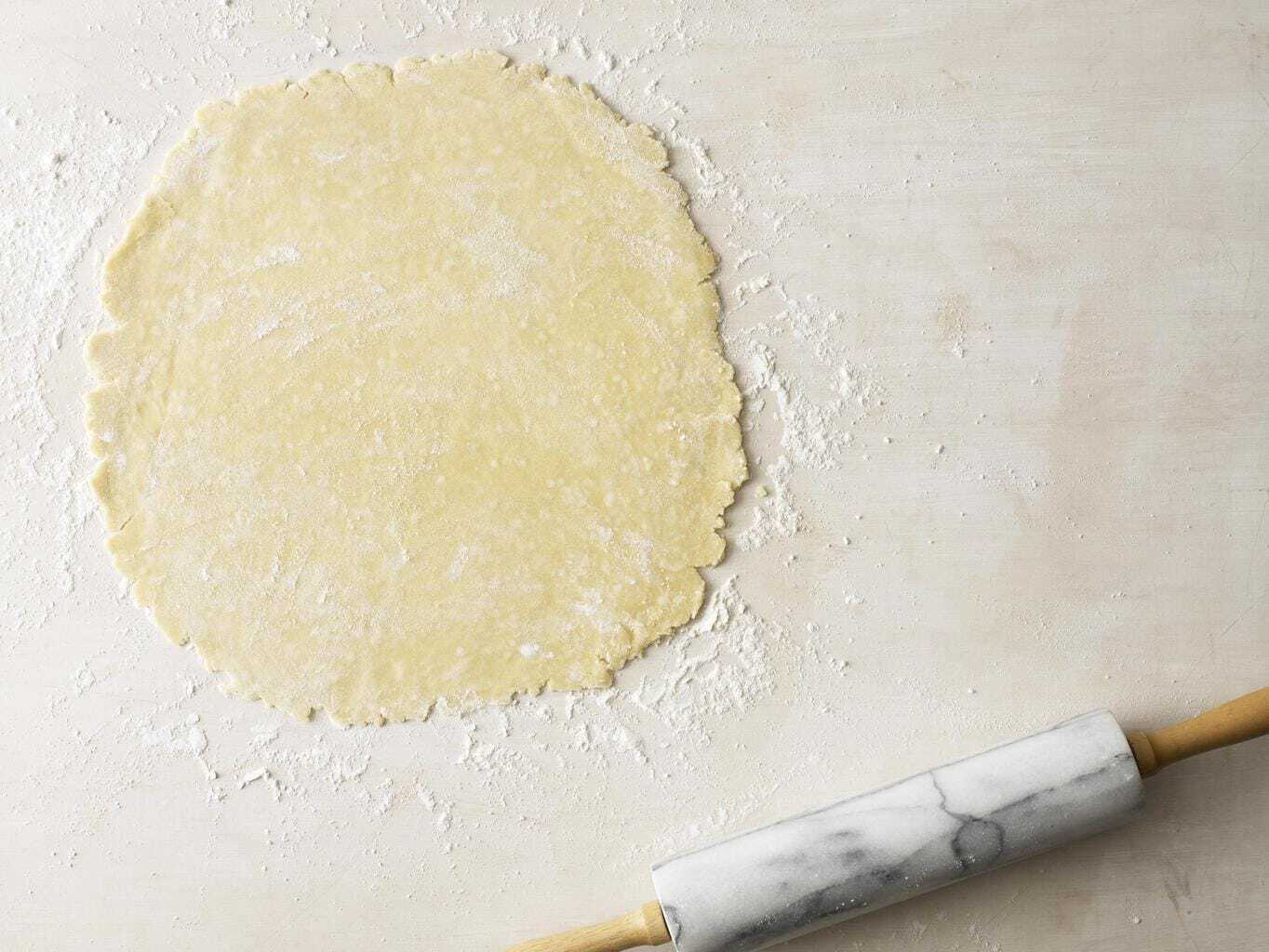 rolled pie crust with a rolling pin