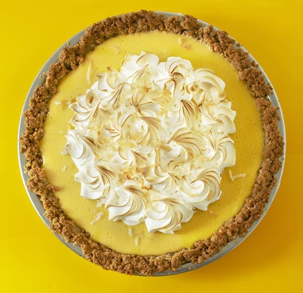 coconut mango pie on bright yellow background