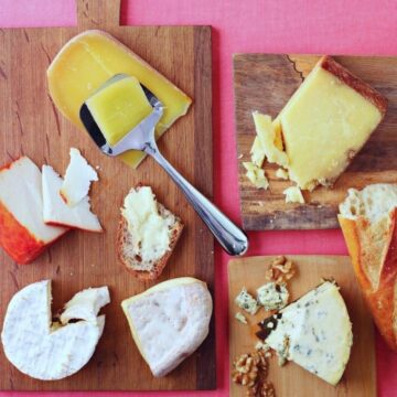 Image for Cheeseboard Tips - wood cutting boards with various cheeses