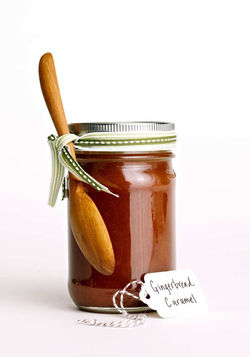 Gingerbread Caramel Sauce with a ribbon in a jar