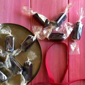 Black Licorice Caramels on pink surface