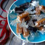 Vanilla and licorice caramels in blue bowl