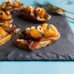 Mandarin & Prosciutto Bruschetta on slate platter