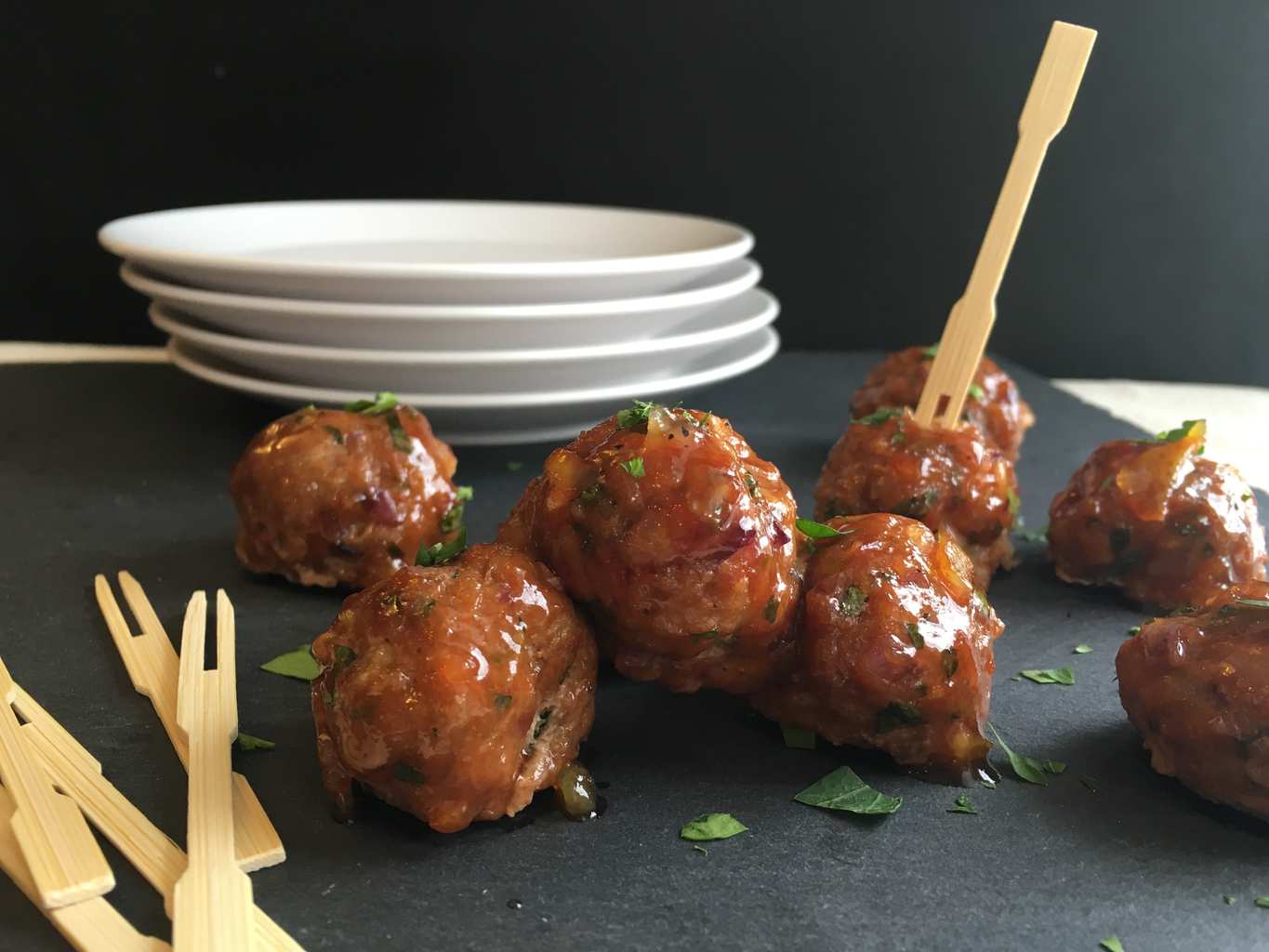 Chicken Meatballs on gray surface with wooden toothpicks