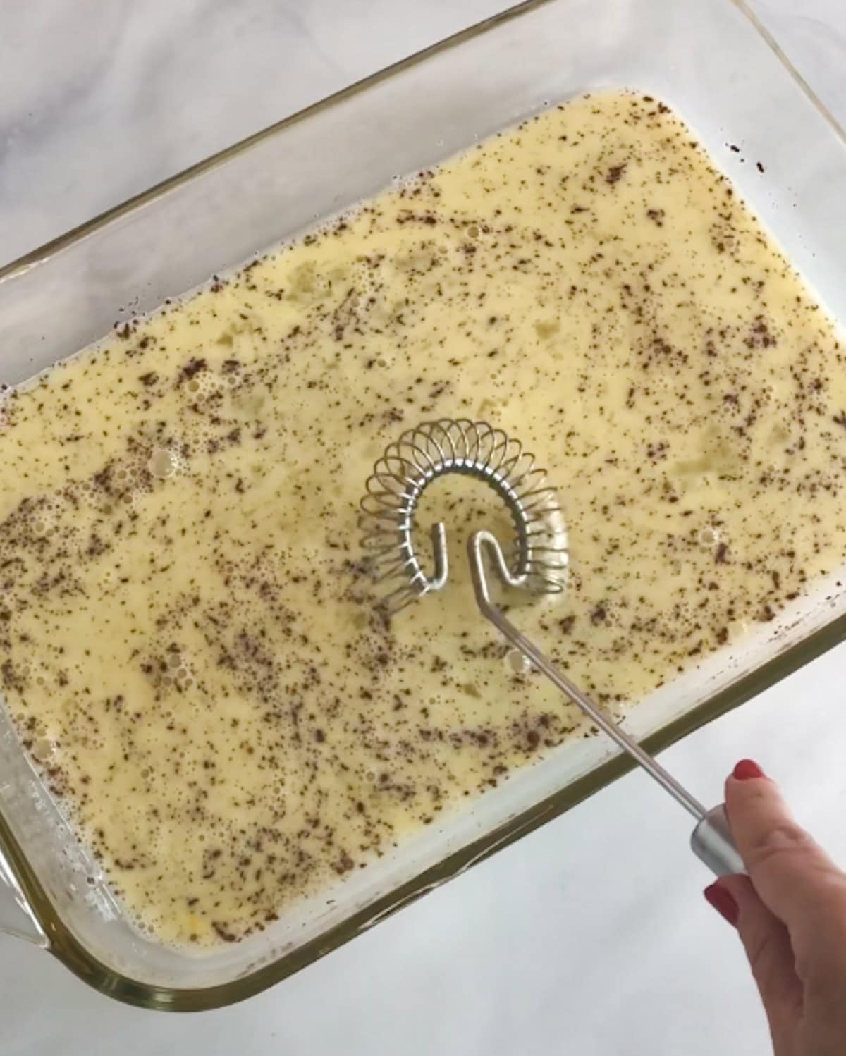 Egg mixture for French toast in a 9x13 pan.