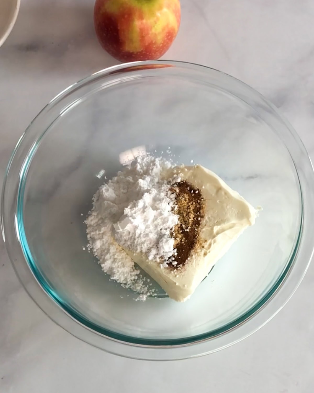 Cream cheese and other ingredients in a bowl to make French toast filling.