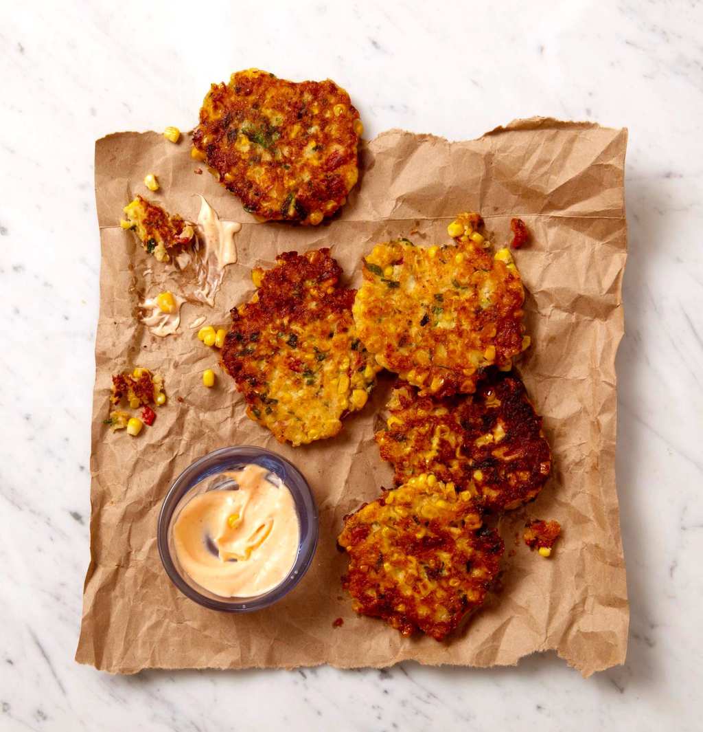 corn fritters dipped with spicy mayo 