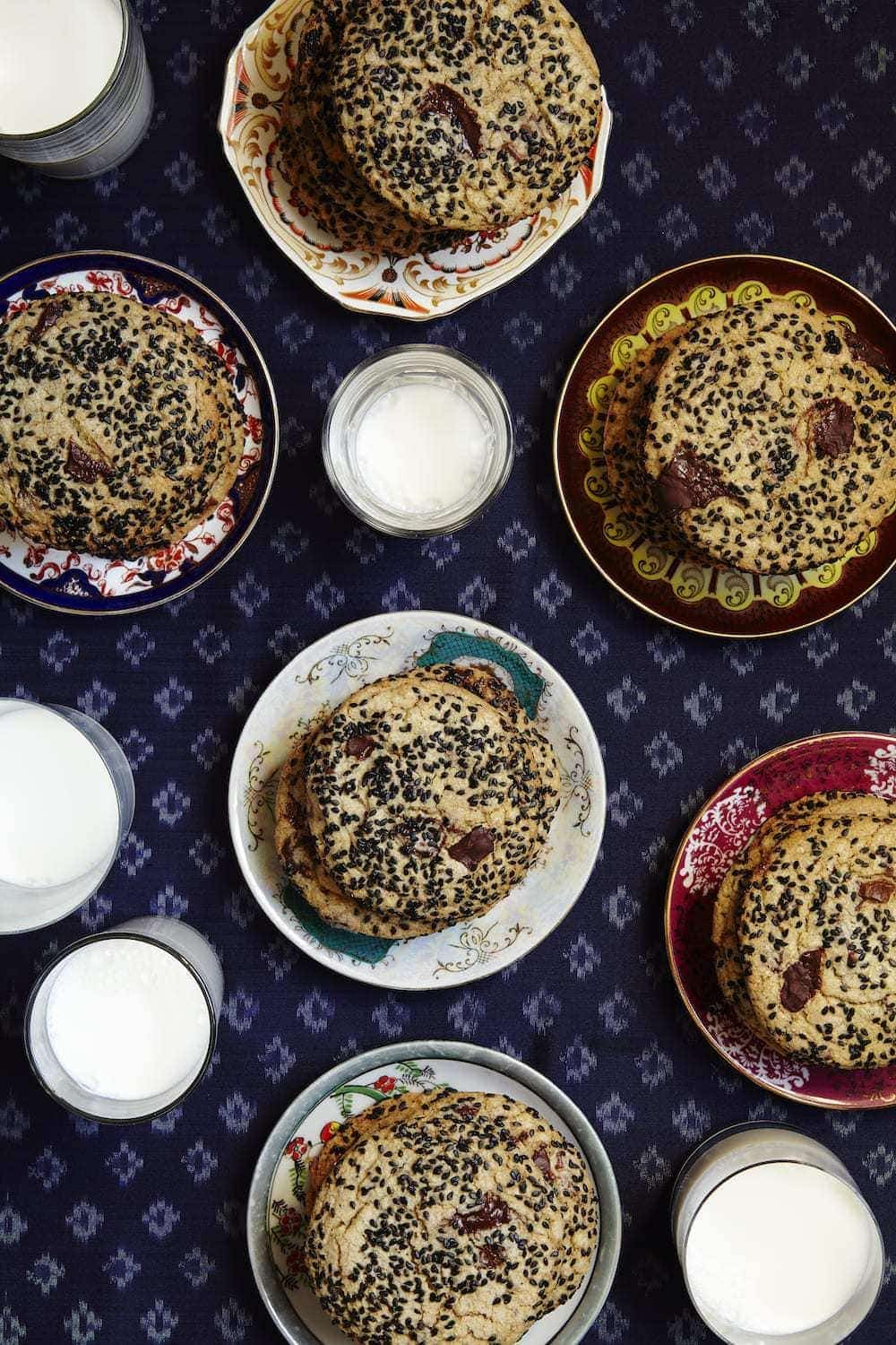 Multiple plates of Black Sesame Cookies Stacked