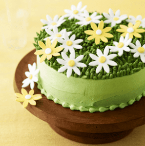 spring daisy cake on a platter