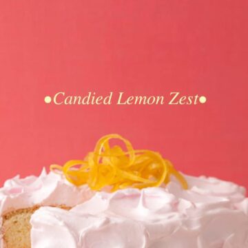 Close up image with text of candied lemon zest on top of pink lemonade cake