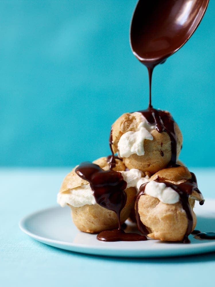 Three Ice Cream Profiteroles with vanilla ice cream and chocolate sauce