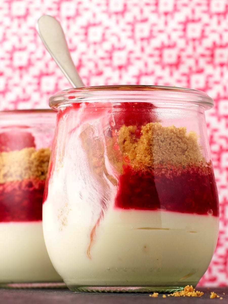 Easy Cheesecake in a Jar with bite missing spoon