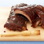 3 ingredient ribs on cutting board with brush