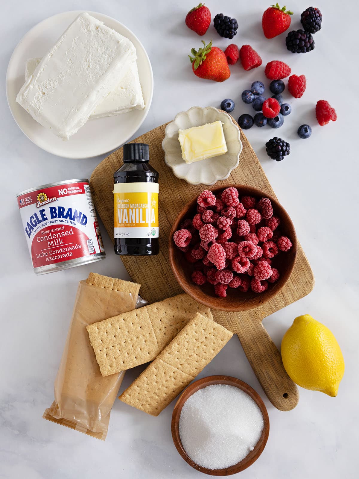 Ingredients needed to make mini cheesecakes in jars.