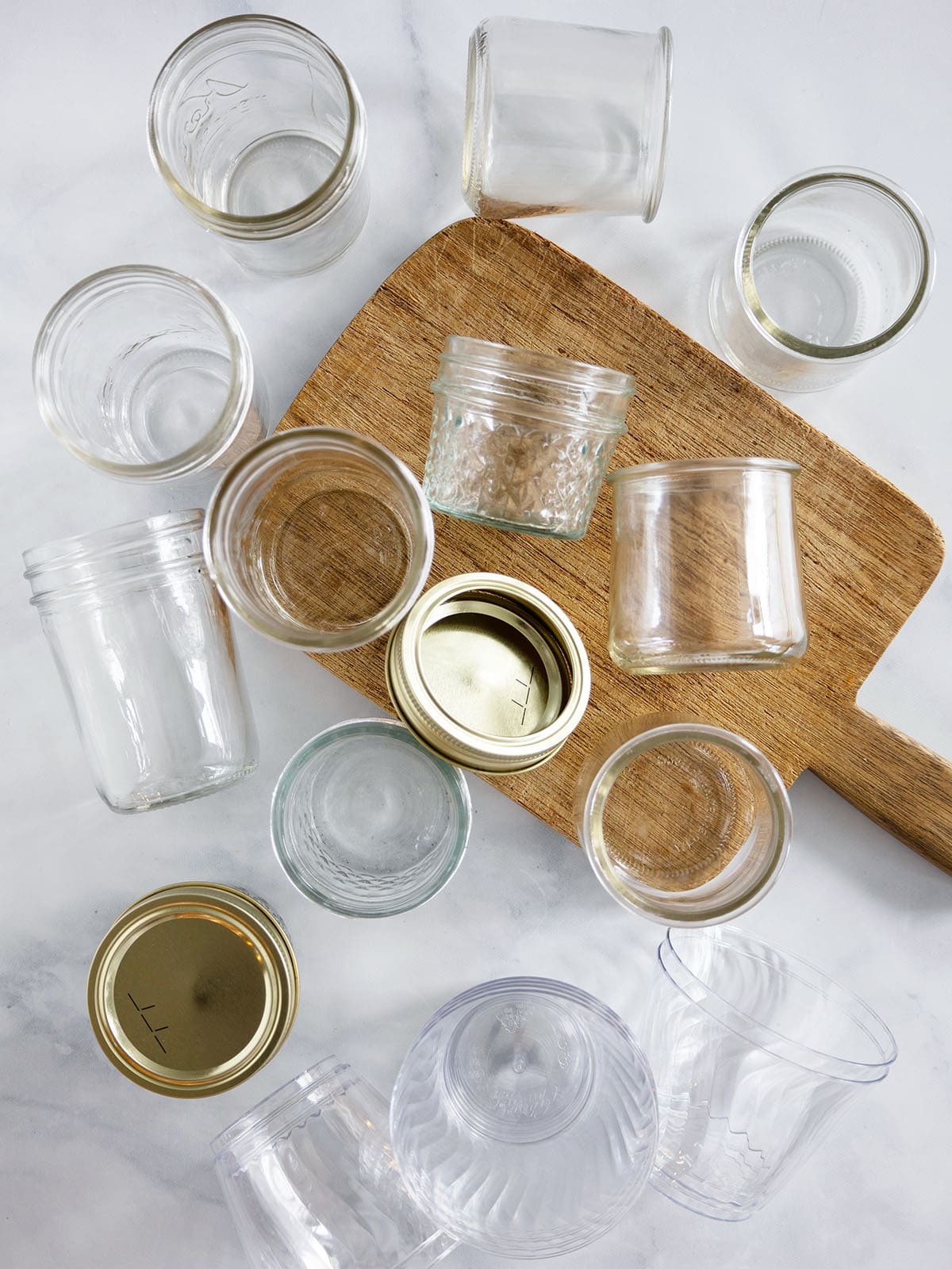 An assortment of different jars to use for mini cheesecakes.