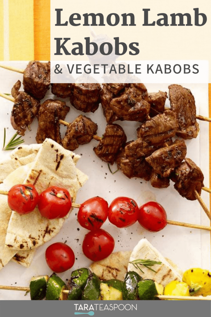 Lamb and vegetable kabobs on white platter