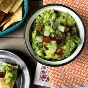 Summer Grape Guacamole in bowl on table