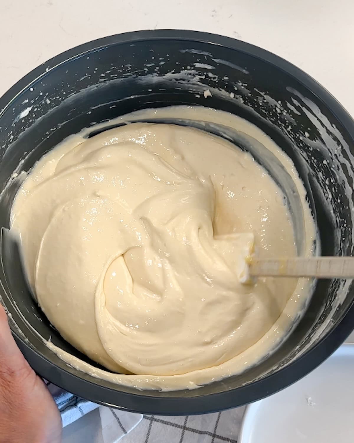 Smooth no-bake cheesecake filling in a mixing bowl.
