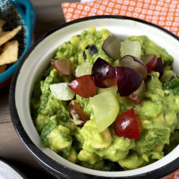 Summer Grape Guacamole in bowl on table