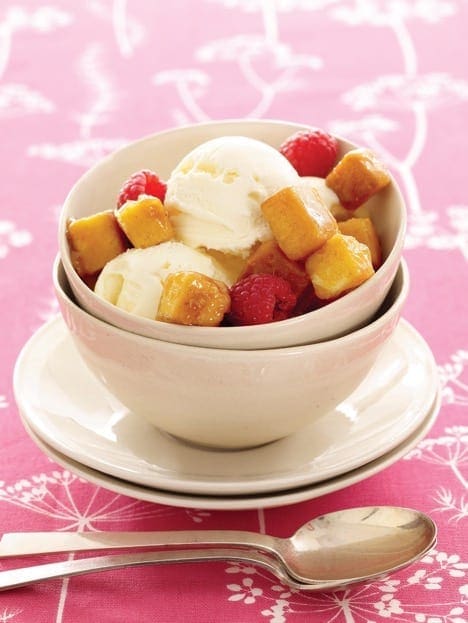 pound cake covered in caramel sauce to make croutons, on top of ice cream