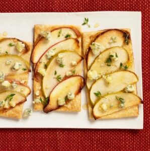Easy apple and blue cheese tarts on white platter