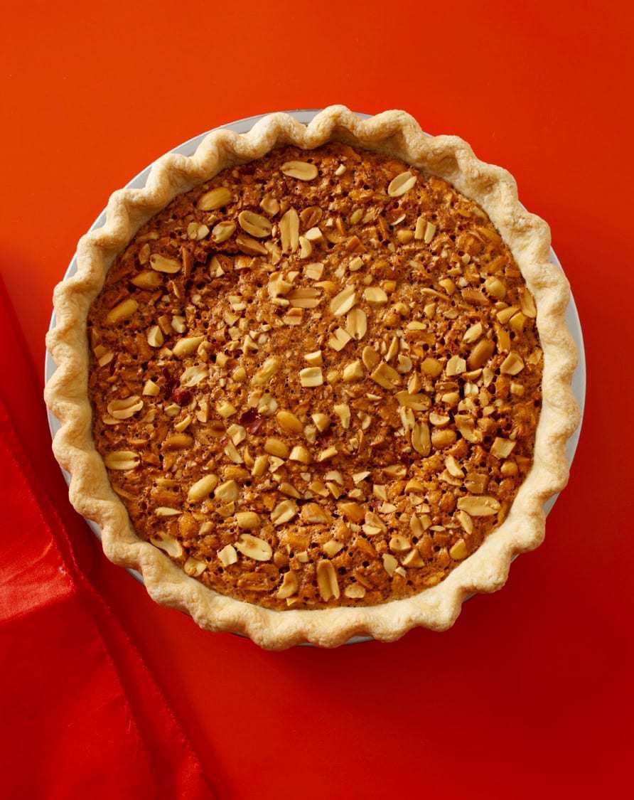 Gooey Peanut Pie on red background