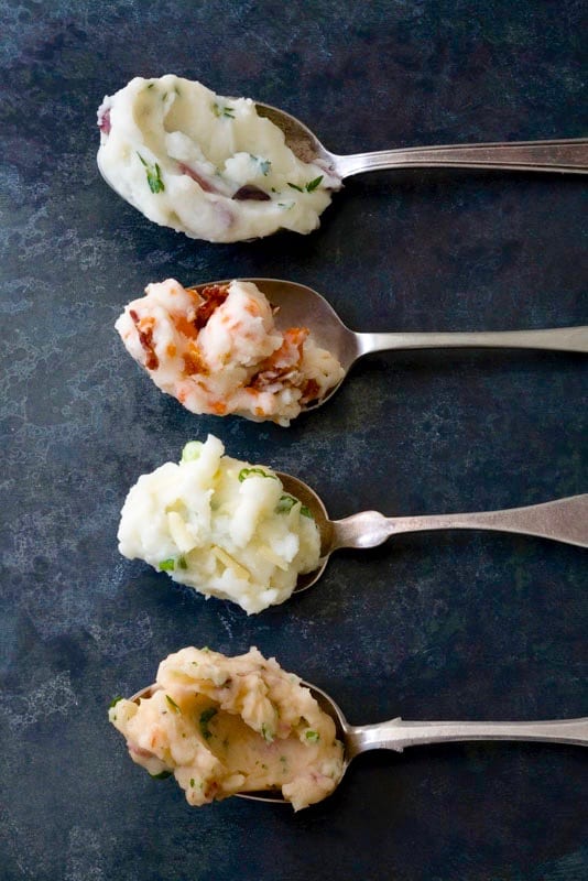 4 spoons of mashed potatoes with different mix in ingredients