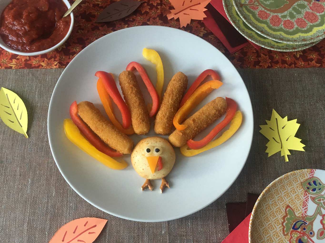 Mozzarella Sticks Turkey Snacks on white plate w fall leaves
