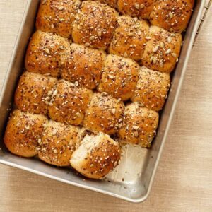 Dinner Rolls with Savory Seed Topping in baking pan