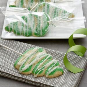 Oh Christmas Tree Lollipop Cookies, how I want to eat thee! Especially when you are soft, iced cookies with orange essence!