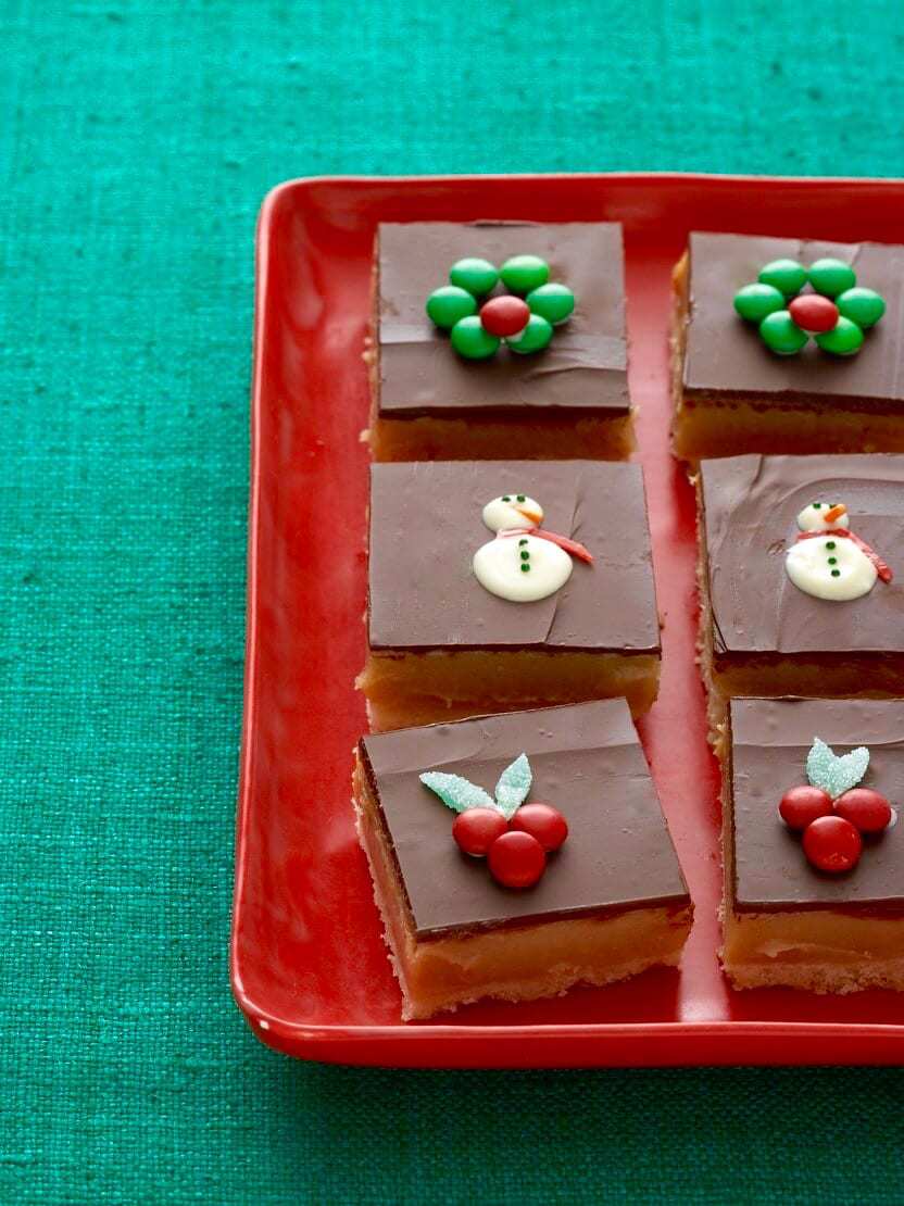 Dulce de leche bars on red platter and green linen