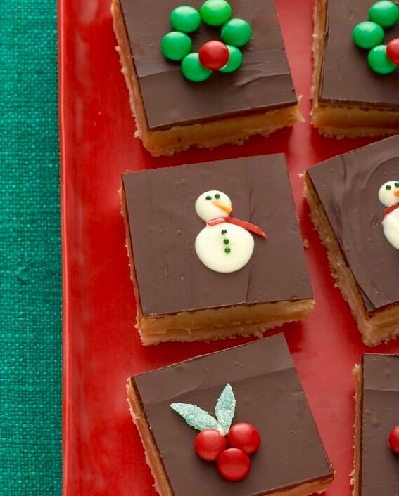 Dulce de leche bars closeup on red platter and green linen