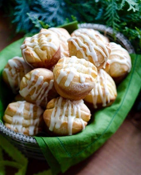 Pull-apart Orange Rolls in basket with green napkin