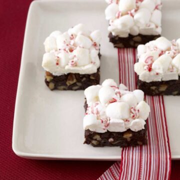 Peppermint cloud brownies with marshmallows on white platter