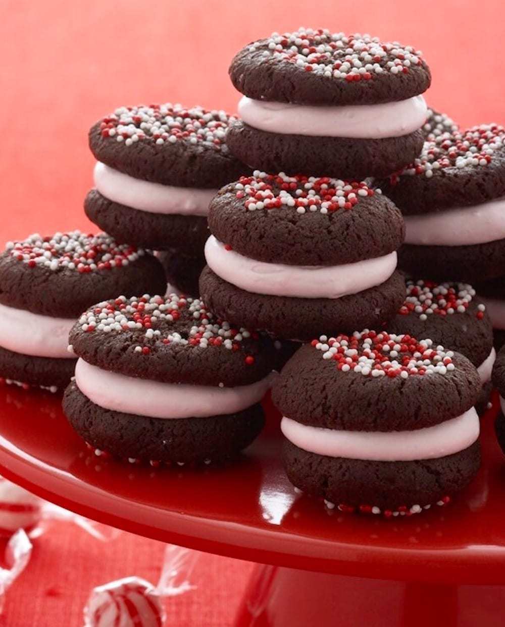 Peppermint Marshmallow Sandwich Cookies on red cake plate