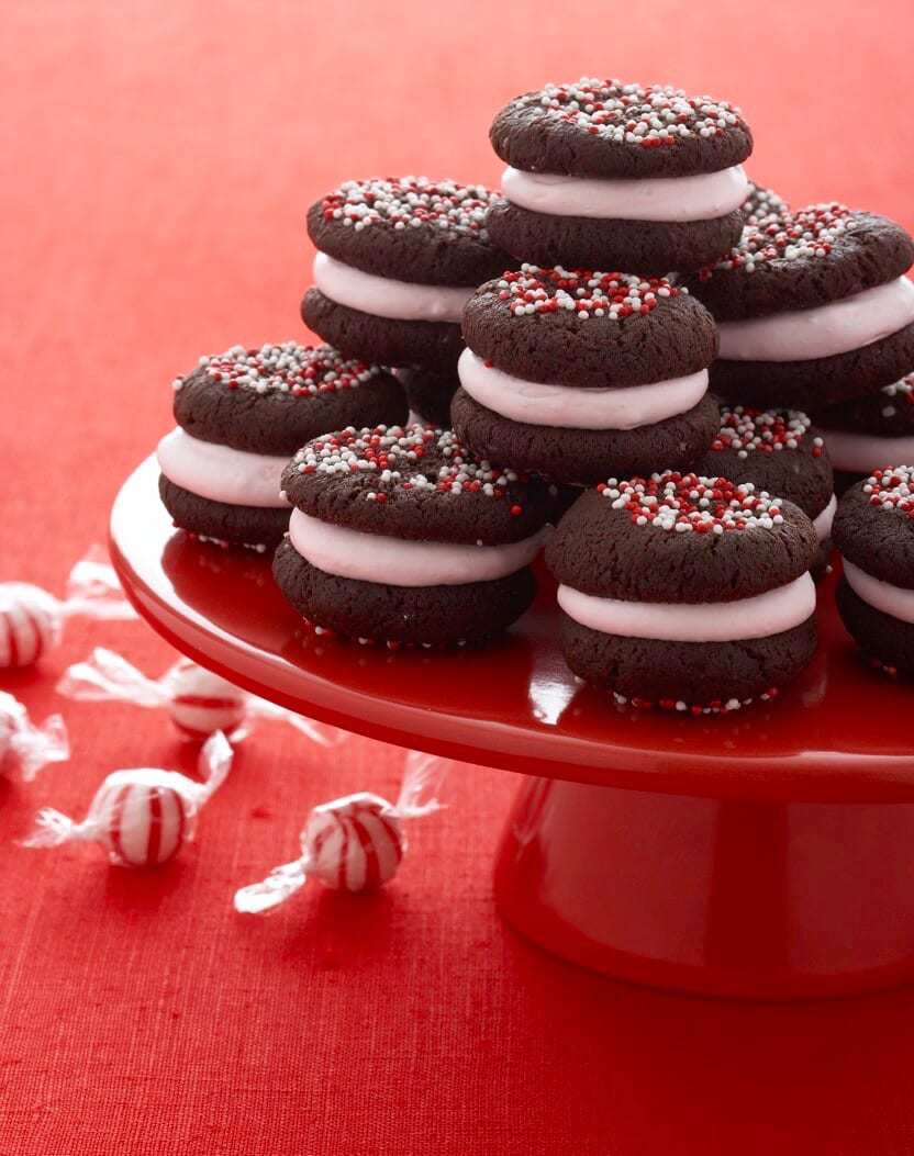 Peppermint Marshmallow Sandwich Cookies on red cake plate with mint candies
