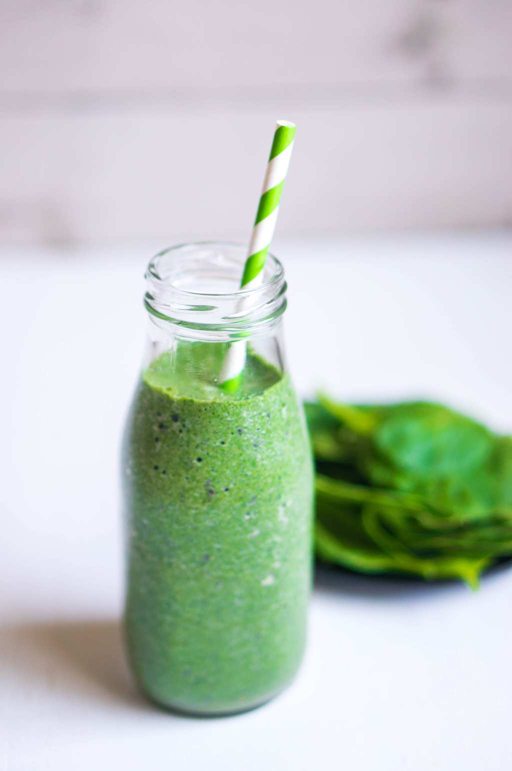 Green Goddess Smoothie in jar with straw