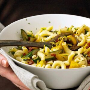 Close up of Squash and Pancetta pasta in white serving bowl