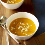 Two bowls of Chipotle Sweet Potato Soup with Queso Blanco