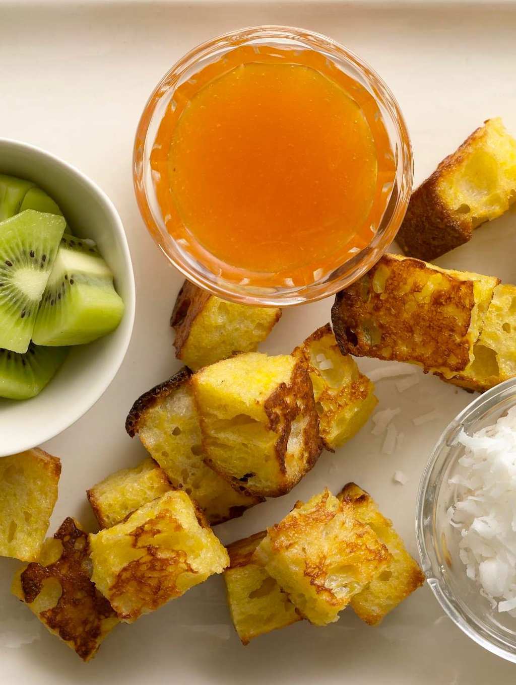 Oven baked French toast fondue makes a brunch much more fun and delicious.